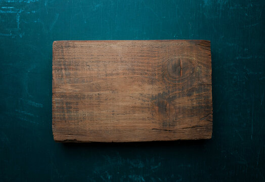 Empty kitchen background with old cutting board,  for your product. food background. kitchen. Top view.
