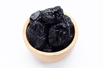 Dried prunes on white background