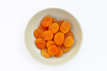 Dried apricots on white background.