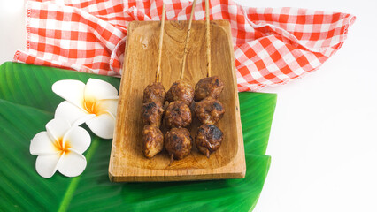 Delicious grilled meatballs (bakso bakar). Indonesian snack. Selective Focus