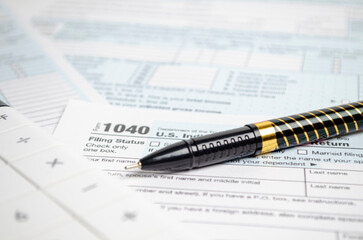 Naklejka na ściany i meble Tax forms, spread sheet with pen and calculator.