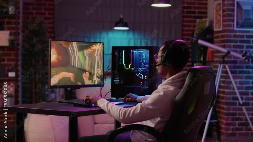 Poster statict tripod shot of african american gamer streaming first person shooter while explaining gamepl