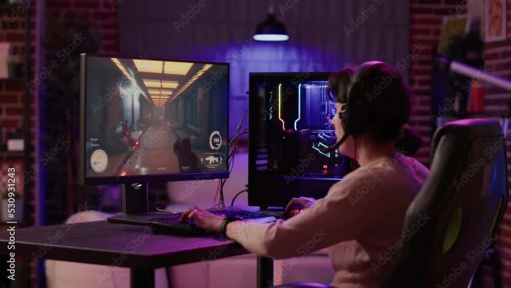 Poster gamer girl using pc setup playing multiplayer first person shooter talking on headset while explaini