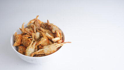 Delicious small crab fried in white bowl. isolated on white background.Selective Focus