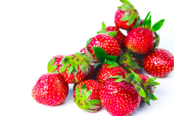 Small Strawberries on a White Background