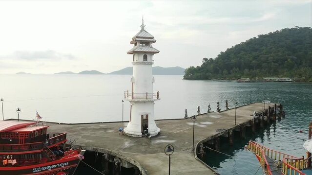 Beautiful aerial view of white lighthouse at the end of Bang Bao Pier. Located in the southwest corner of Koh Chang Island, Trat.