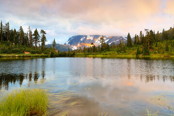 Mount Shuksan at sunset with reflection view from Picture Lake, Deming Washington.  Picture Lake is the centerpiece of a strikingly beautiful landscape in the Heather Meadows area