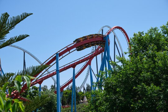 Inverted Roller Coaster With Narrow Metal Rails, An Ideal Summer Day To Enjoy Vacations