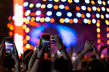 Fototapeta na wymiar People taking photographs with smart phone during Live music concert