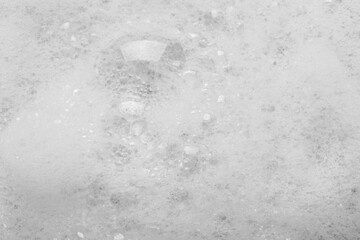 Fluffy bath foam as background, top view