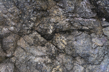 Textured of old stone surface as background, closeup