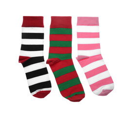 Different striped socks on white background, top view