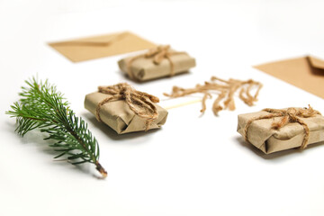 Christmas tree made of rope, jute, twine and wooden match on white background. Eco craft gift boxes. Organic eco craft Christmas tree. Creative art holiday. Simple xmas backdrop. Rope bow. Side view