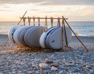 Folded windsurf boards.  Sports equipment at sea. Boards for skiing.
