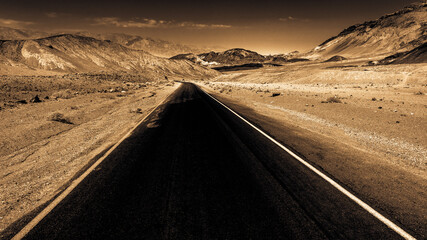 Monochrome color image of a road to Death Vally.