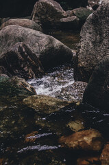 picture of a waterfall that flows fresh in the mountains and is a place of recreation for residents and tourists who come