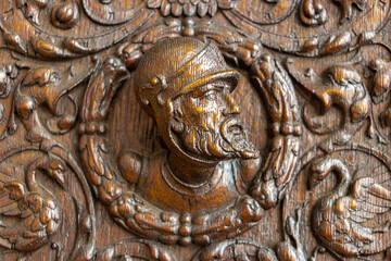 Carved decoration on the wall of a cabinet from the 16th century