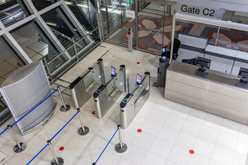 Airport interior with empty entrance gate to the plane