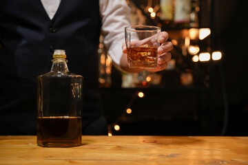 Barman pouring whiskey whiskey glass beautiful night