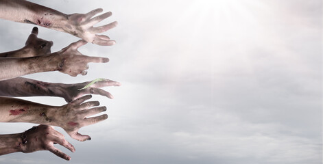 Hands of zombies on light background