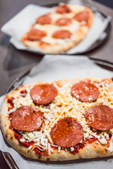 healthy plant-based food, homemade pizza with dairy-free cheese and vegan pepperoni before getting cooked