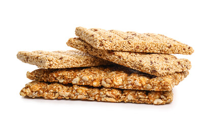 Stack of tasty sesame kozinaki on white background