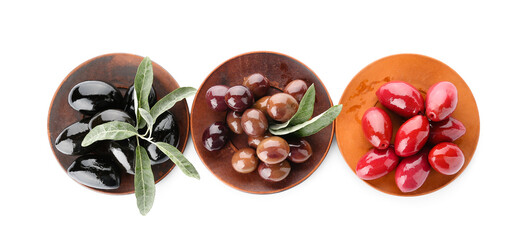 Plates with different kinds of tasty olives on white background