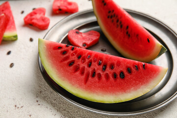 Plate with slices of watermelon on white background, closeup