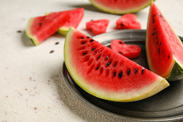 Plate with slices of watermelon on white background, closeup