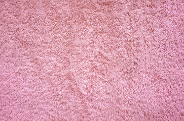 Rose pink towel cloth texture background. Fluffy fabric textile backdrop.