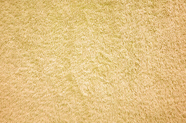 Orange towel cloth texture background. Fluffy fabric textile backdrop.