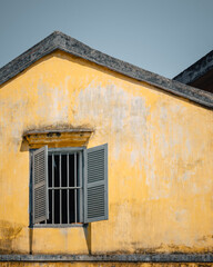 Hoi An, Vietnam - July 29th, 2022 : colorful facade of a house in Hoi An, Vietnam on a sunny day