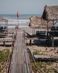 Danang, Vietnam - March 7th, 2020 : wooden constructions in a restaurant on the beach with wooden...