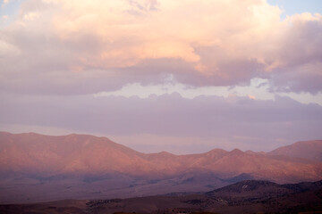 Soft evening light on the hills and clouds at sunset over D hill in Dayton Nevada