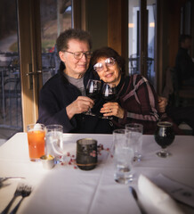 Senior couple celebrating their anniversary in restaurant