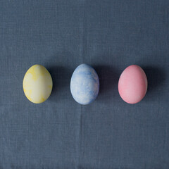 Colorful Easter eggs are lying on the table