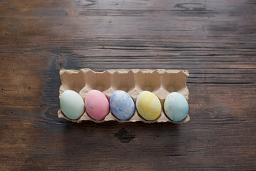 Colorful Easter eggs are lying on the table