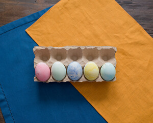 Colorful Easter eggs are lying on the table