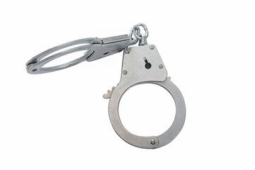 Metal handcuffs on a white isolated background, copy space