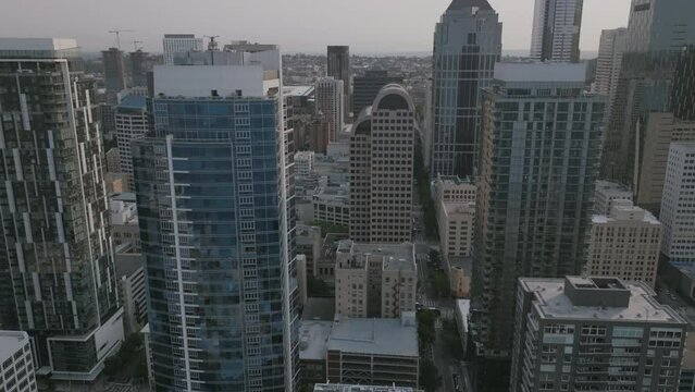 Slow aerial push forward footage of buildings in downtown Seattle, WA.