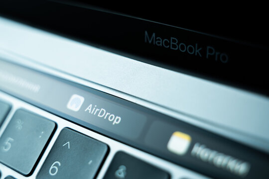 Kiev, Ukraine - August 9, 2022: Wireless File Transfer Method Airdrop On Touch Bar Apple Macbook Pro Closeup