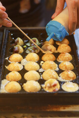 Takoyaki being prepared in Ho Thi Ky street food