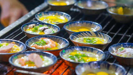banh can or can cake in the ho thi ky street, ho chi minh city