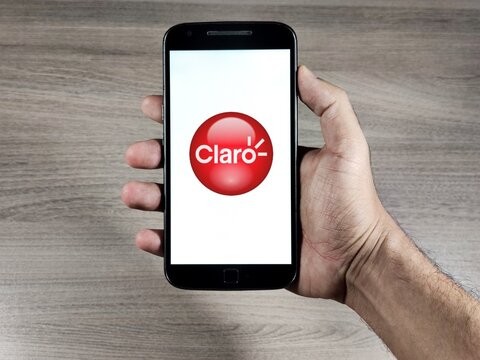 operator Claro logo on the smartphone screen. Claro is a concessionaire of mobile telephony, fixed telephony, broadband and pay TV.