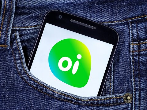 operator Oi logo on the smartphone screen. Oi previously known as Telemar, is a telecommunications services concessionaire in Brazil.