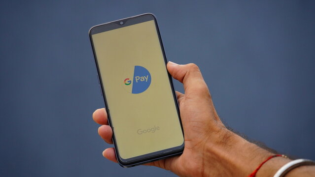 Nangloi, Delhi, India- 14 september 2022 :man holding smartphone with gpay app on screen