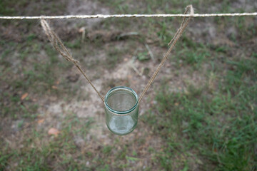 glass jar tied with natural rope