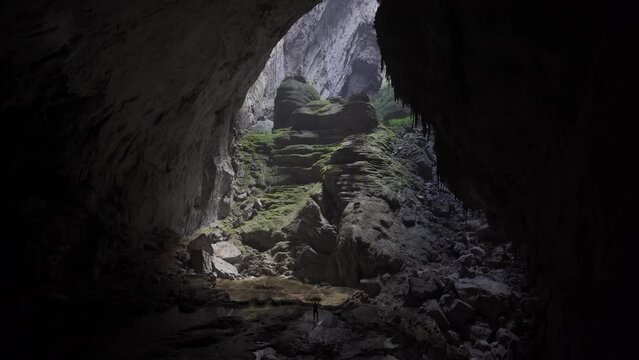 Shot of tiny person inside a big cave