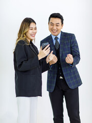 Millennial Asian cheerful successful professional male businessman manager female businesswoman colleague in formal suit standing smiling holding using laptop computer together on white background