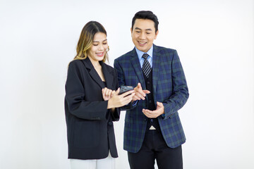 Millennial Asian cheerful successful professional male businessman manager female businesswoman colleague in formal suit standing smiling holding using laptop computer together on white background